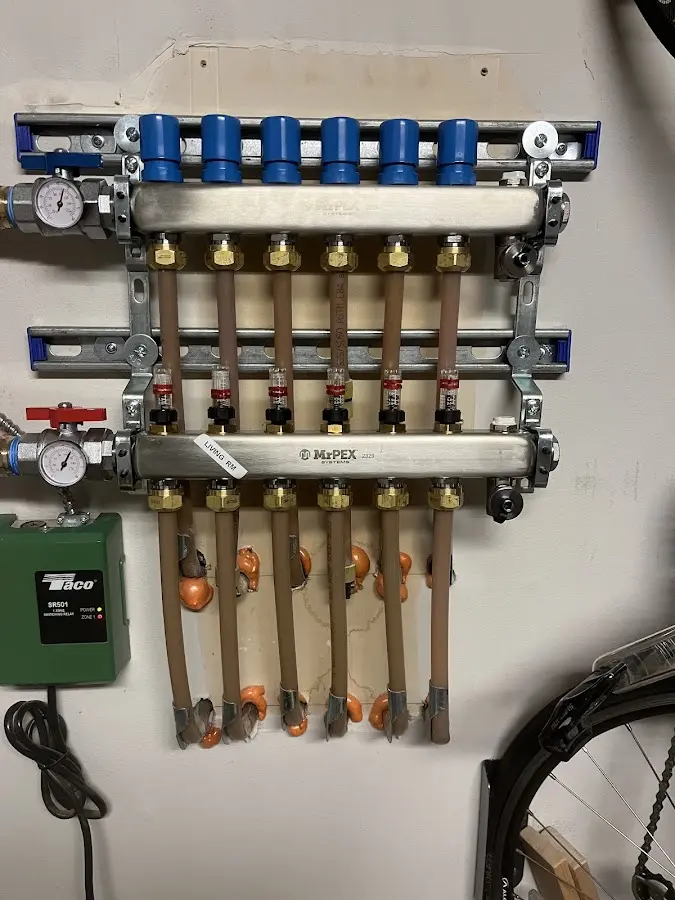 Plumber performing Gas Line Installation at a residential property in Londonderry